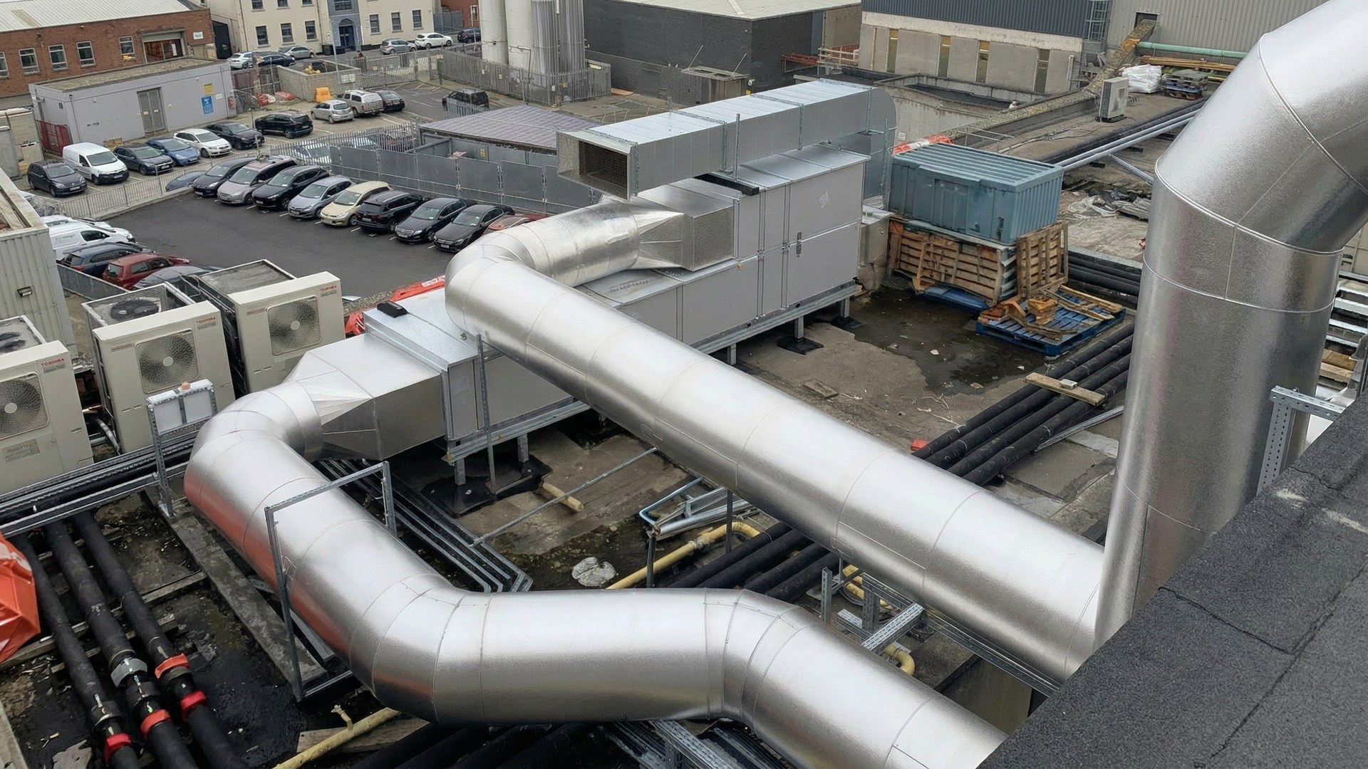 Rooftop aluminium-clad pipework and ductwork on commercial building — contact Alumitherm Assist Ltd Dublin