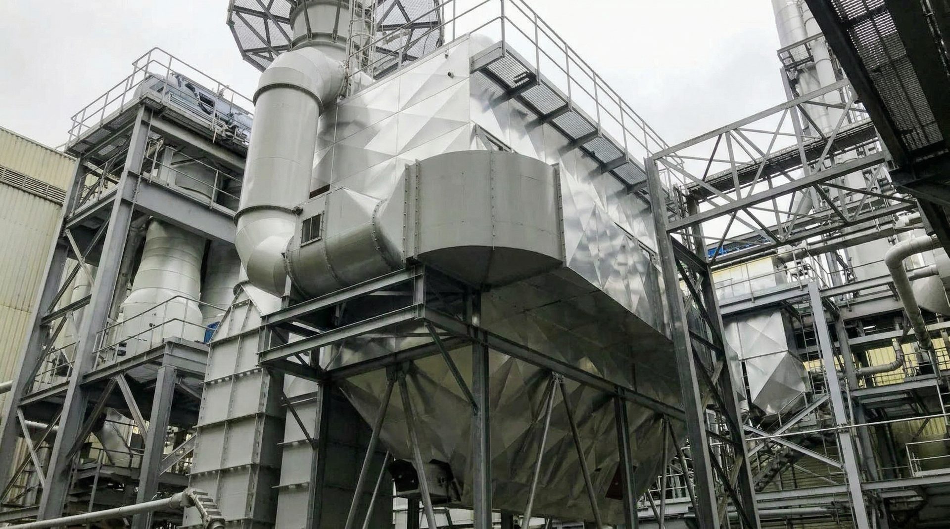 Industrial diamond-pattern aluminium cladding on processing equipment — insulation project Dublin